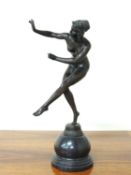 ART DECO STYLE BRONZE FIGURE OF A NUDE DANCER, unsigned, mounted on a grey marble sphere base, 46cms