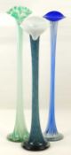 THREE DECORATIVE COLOURED GLASS FLOOR STANDING ORCHID / STEM VASES, tallest 84cms (h), smallest