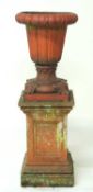 VICTORIAN TERRACOTTA GARDEN URN, on a later weathered reconstituted stone pedestal, urn 60cms (h),