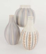 THREE POOLE POTTERY CONTEMPORARY VASES, comprising YAP (185), 11.5cms (h); YCB (688), 15cms (h); and