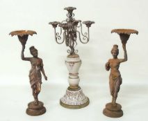 PAIR OF DECORATIVE CAST-IRON FIGURAL CANDLESTICKS, 62cms (h); together with a French style ceramic