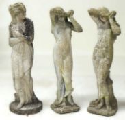GARNITURE OF THREE WEATHERED RECONSTITUTED STONE GARDEN FIGURES, comprising pair of water nymphs and