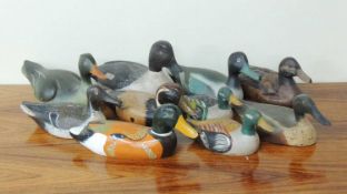 NUMBER OF PAINTED WOODEN DECOY DUCKS, including Pintail, Shoveler, and others (10) Provenance: The