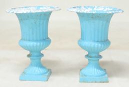 PAIR OF CAST IRON CAMPAGNA GARDEN URNS, with egg and dart collar, raised on square base, 48 (h) x