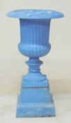 PAINTED CAST IRON GARDEN PEDESTAL URN, on a stepped square plinth, 98 (h) x 54cms (diam.)