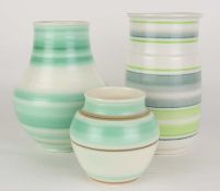 THREE POOLE PICOTEE COLOUR BANDED POTTERY VASES, all c. 1950s, including a cylinder vase, 22.5cms (