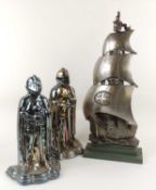 TWO DECORATIVE STOVE ENAMELLED NIGHT COMPANION STANDS, and a cast iron galleon companion stand,