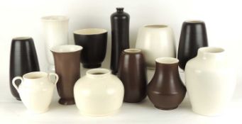 NUMBER OF POOLE POTTERY VASES, finished in magnolia white, chocolate brown, and black panther
