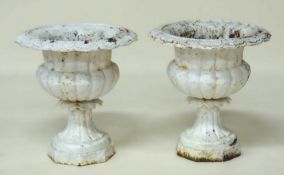 PAIR OF WHITE PAINTED CAST IRON GARDEN URNS, with lappet collars and octagonal base, 45 (h) x