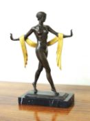 ART DECO STYLE BRONZE & PARCEL GILT FIGURE STRIDING OUT, unsigned, on black marble base, 41cms (h)