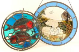 TWO DECORATIVE STAINED-GLASS ROUNDELS, one featuring fishes (with cracks), 33cms (diam.); the