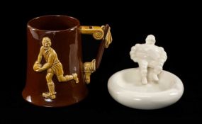 RUGBY CLUB HOUSE: DARTMOUTH POTTERY NOVELTY TANKARD, modelled with rugby player, ball sailing over