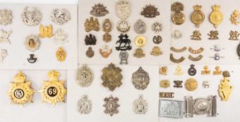 MILITARY CLUB HOUSE: COLLECTION OF SHAKOS & HELMET PLATES, to include South Wales Borderers helmet