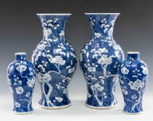 TWO PAIRS CHINESE BLUE & WHITE PORCELAIN VASES, painted with flowering prunus branches, both with