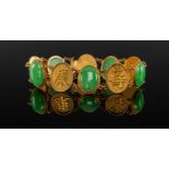 CHINESE 18CT GOLD & JADEITE BRACELET, alternating oval shou-character and cabochon apple green