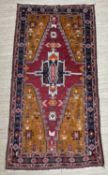 ANATOLIAN TURKISH RUG, Konya, stylised geometric medallion on madder field, orand spandrels,