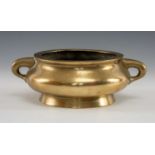 CHINESE BRONZE CENSER, Qing Dynasty, bombé form with twin loop handles, tapering foot, base with