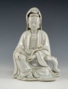 CHINESE BLANC DE CHINE PORCELAIN FIGURE OF GUANYIN, Dehua Province, seated in flowing robes and