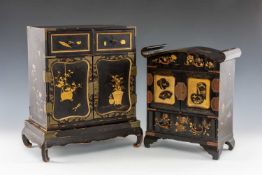 TWO JAPANESE BLACK & GOLD LACQUER TABLE CABINETS, both in the shape of kodansu, larger with