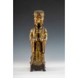 MING DYNASTY GILT LACQUERED BRONZE FIGURE OF AN OFFICIAL, late 17th C, standing in flowing robes