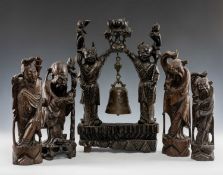CHINESE WIRE-INLAID HARDWOOD CARVINGS, comprising four figures, and a figural gong stand (5)