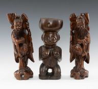 THREE CARVED WOOD FIGURES, comprising Southeast African kneeling figural bowl 28cms (h), and pair