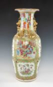 CANTON FAMILLE ROSE VASE, 19th C., decorated with panels of Manchu figures and birds, insects, fruit
