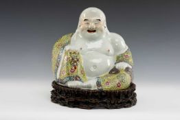 CHINESE FAMILLE ROSE PORCELAIN FIGURE OF BUDAI, Republic, seated in loose robes decorated with
