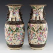 PAIR CHINESE CRACKLEWARE VASES, 20th C., decorated with Bannermen, chilong and Buddhistic lions