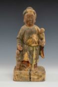CHINESE CARVED WOOD FIGURE GROUP, 19thC., carved in the Ming dynasty style, of a matron in floral