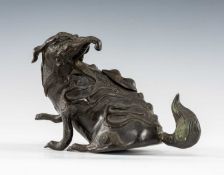 JAPANESE BRONZE BAKU CENSER & COVER, Meiji period, the mythical animal seated with head turned to