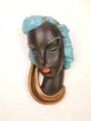GOLDSCHEIDER ART DECO WALL MASK of a lady, turquoise and gold glaze, impressed marks to reverse,