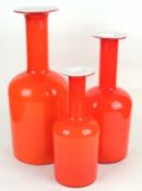 THREE GRADUATED HOLMEGAARD GULVVASES, in orange with white interiors, 44cms (h) the tallest (3)