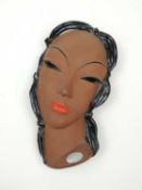 GOLDSCHEIDER ART DECO WALL MASK of a lady with black hair, with original maker's label, 22cms (h)