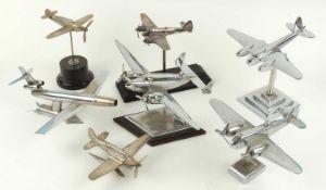 SEVEN METAL MODEL AIRCRAFT including de Havilland Mosquito on chromed plated stepped stand, 21cms (