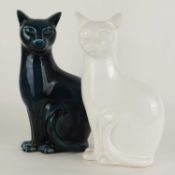 POOLE POTTERY CAT, in the 'dolphin' blue glaze, 30cms (h); together with a Poole white glazed cat,