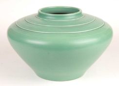 KEITH MURRAY FOR WEDGWOOD: MATT GREEN SQUAT BALUSTER VASE, facsimile signature factory mark and