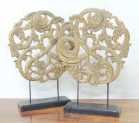 PAIR OF DECORATIVE GILT CAST PLASTER ROUNDELS, each mounted on a painted black base, 65 (h) x