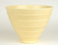 KEITH MURRAY FOR WEDGWOOD: STRAW GLAZED RIBBED CONICAL BOWL, KM factory mark, 14.5cms (h)