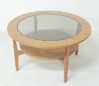 RETRO TEAK FINISH SMOKED GLASS TOPPED CIRCULAR COFFEE TABLE, with circular under shelf, attributed