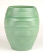 KEITH MURRAY FOR WEDGWOOD: MATT GREEN RIBBED BARREL VASE, facsimile signature factory mark, 16.