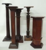 FOUR WOODEN TORCHÈRES, including 1920s oak example with square column, 93cms (h), and a hexagonal