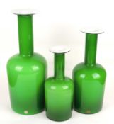 HOLMEGAARD BOTTLE VASES, graduated set of three, in green with white interiors, 44cms (h) the