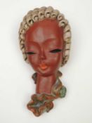 GOLDSCHEIDER ART DECO WALL MASK of a lady with beige curly hair, black printed backstamp and