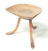 LIBERTY THEBES STOOL, dished walnut seat, on three shaped elm supports, 35 (h) x 36cms (w)