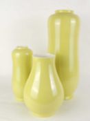 POOLE YELLOW MARROW VASE (MK 41), 43.5cms (h); together with a smaller yellow marrow vase, 27cms (