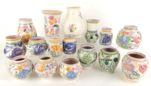ASSORTMENT OF POOLE POTTERY MEDIUM VASES, largest being a sprig vase, 17cms (h); and including three
