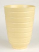 KEITH MURRAY FOR WEDGWOOD: STRAW GLAZED RIBBED VASE, KM factory mark, 19.5cms (h) Provenance: The