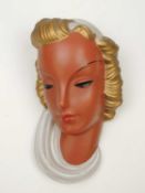 GOLDSCHEIDER WALL MASK, cream and green glaze, original maker's label, 28cms (h) Provenance: The