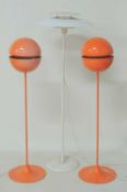 PAIR OF RETRO STYLE ORANGE FINISH METAL GLOBE STANDARD LAMPS, modern, 113cms (h); together with a